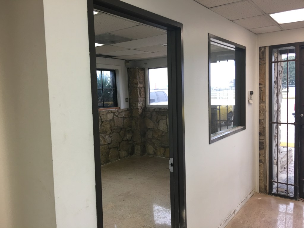 Painting all steel door jambs and window trim with a commercial interior Sherwin Williams paint.