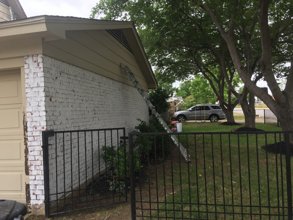 This iron fence is sanded, primed and painted