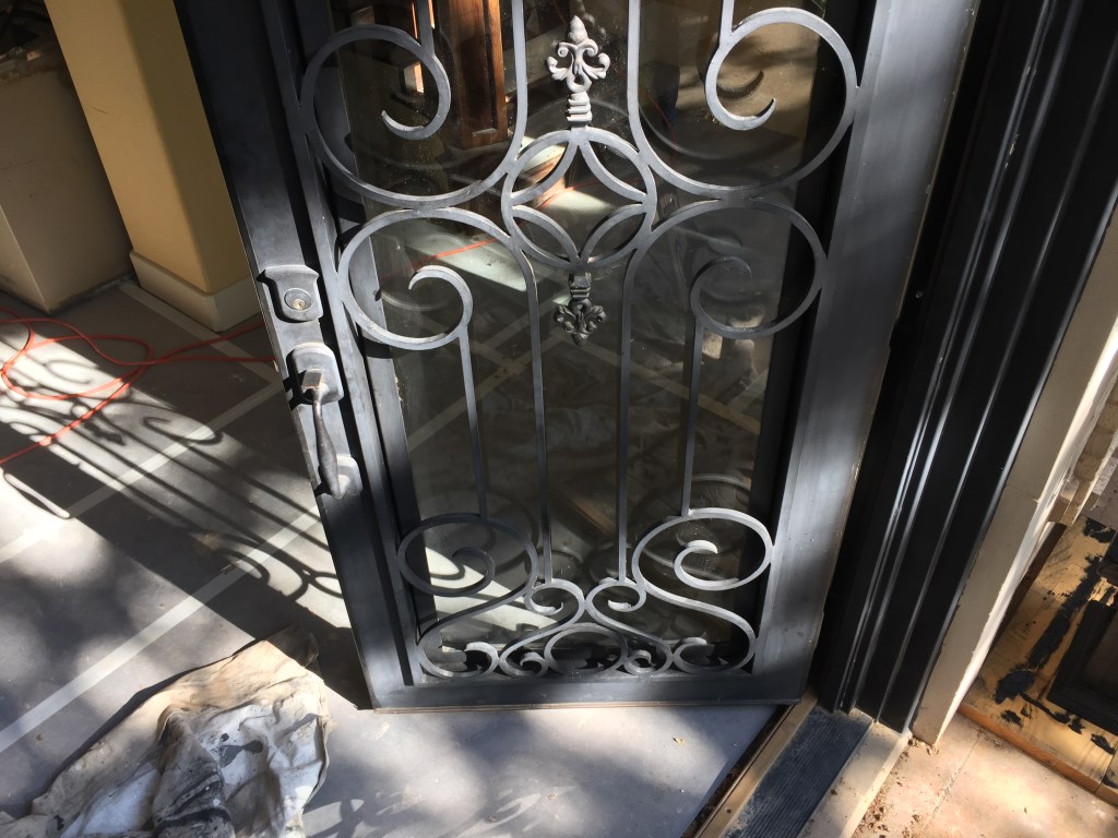 Priming our new iron doors