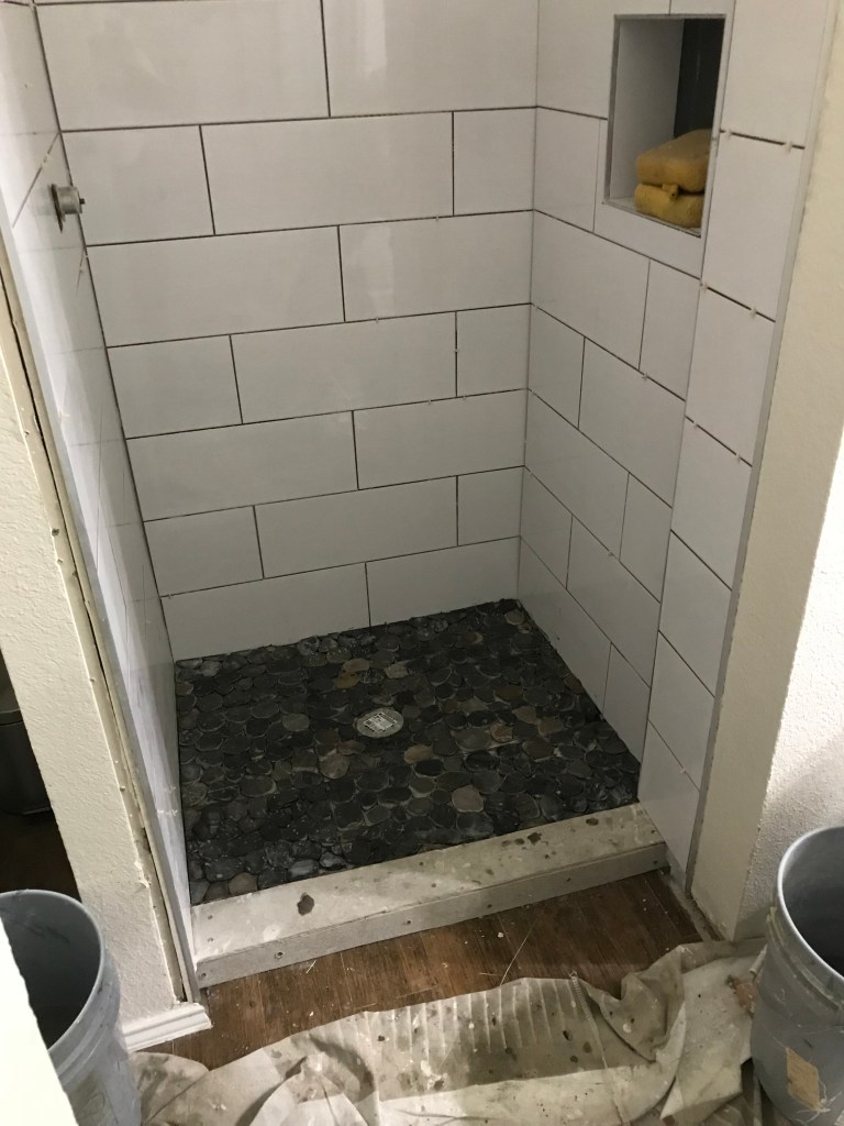 All we have left in our shower remodel is to tile the step in. 