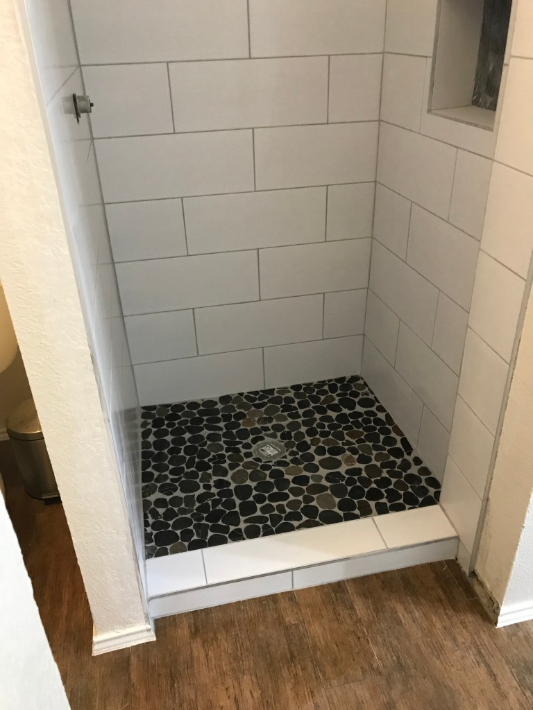 Our shower remodel is almost complete, installation of the shower door and trim kit for the shower handle are the last things to do.