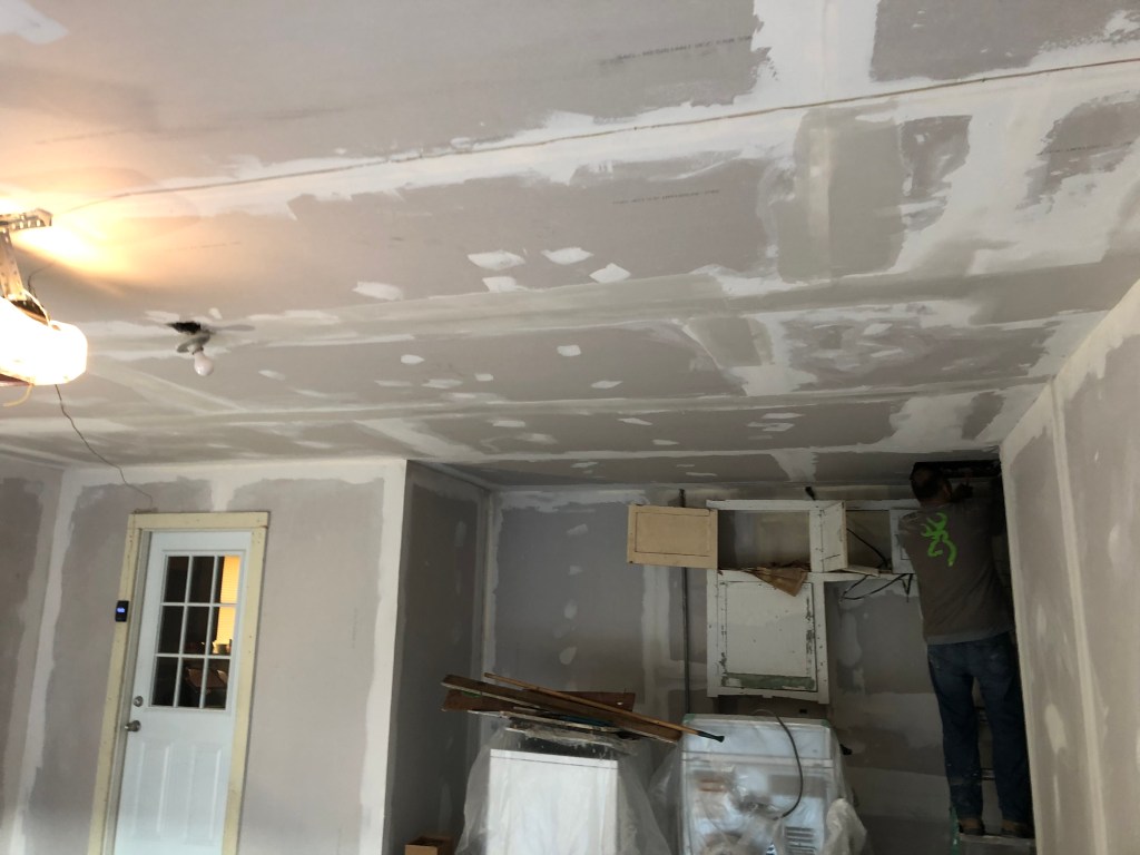 New sheetrock installed, time for taping and bedding