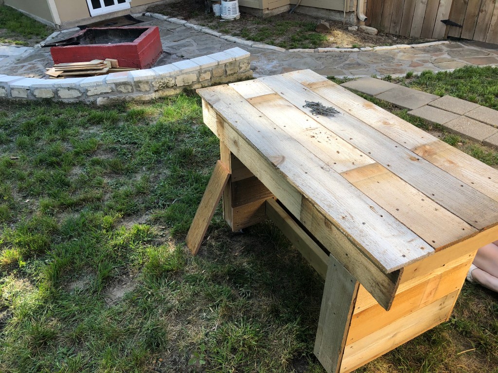 Adding more cedar to the top before we can stain it
